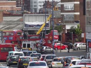 Big_Brum_Buz_stuck_in_traffic_in_Digbeth_-_mobile_crane_(9428026291)